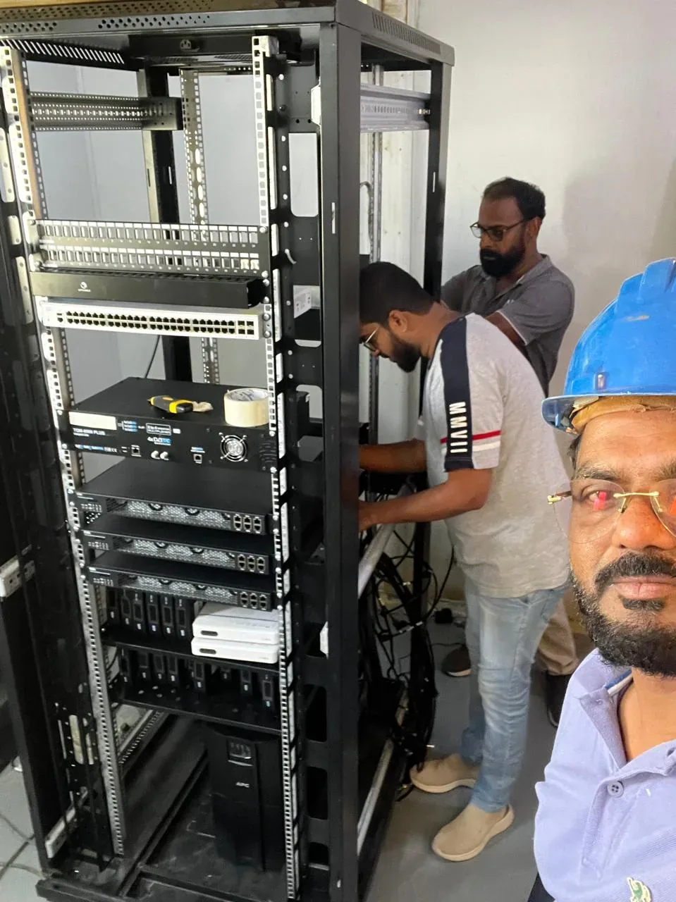 Jubail workforce-accommodation reference depicting iPTV headend and network rack installation for the Saudi labour camp project