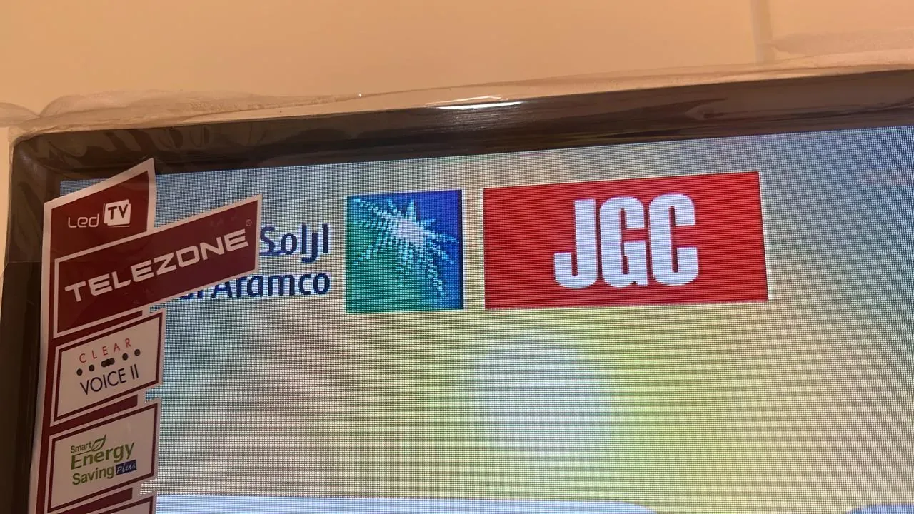 Jubail workforce-accommodation reference depicting iPTV system testing and verification on a Smart TV for the Aramco JGC project