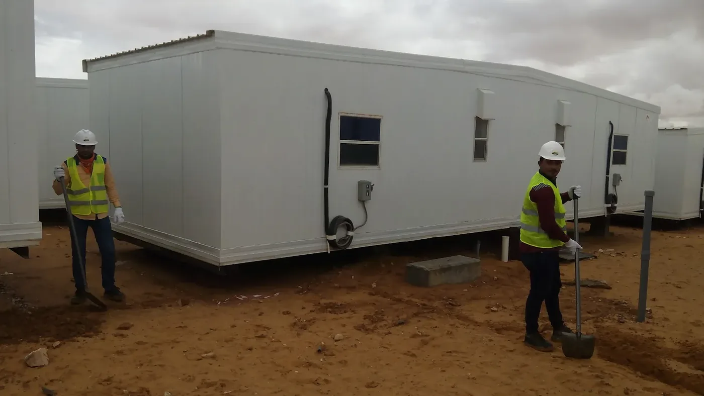 Jubail workforce-accommodation reference depicting labour camp infrastructure work for the Aramco gas and oil project in Turaif