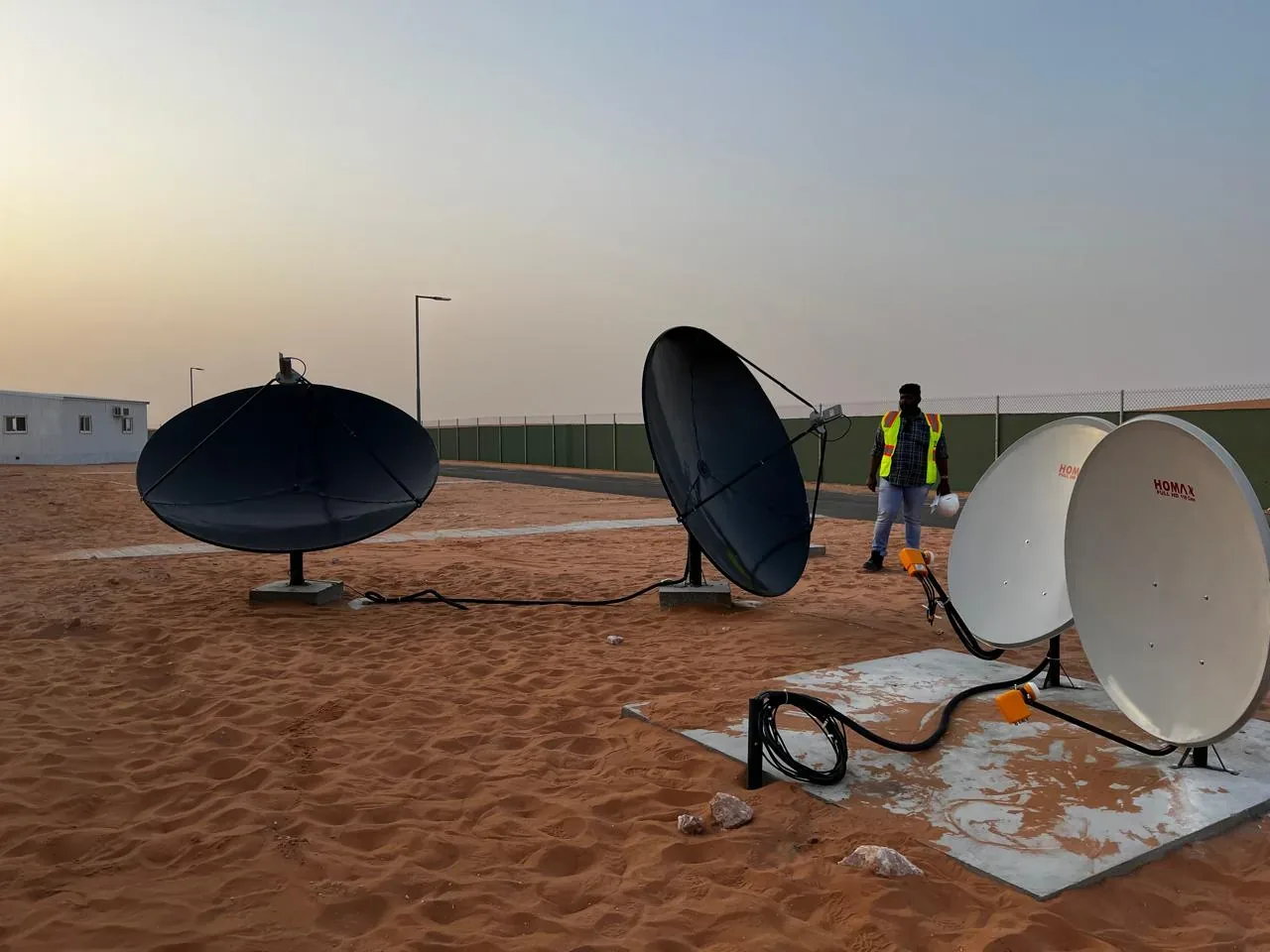 Jubail workforce-accommodation reference depicting satellite reception system installation for the Saudi labour camp IPTV and Wi-Fi project