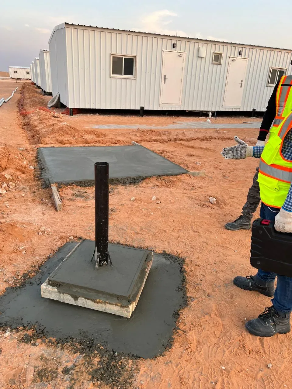 Jubail workforce-accommodation reference depicting satellite system foundation preparation for the Aramco JGC labour camp IPTV and Wi-Fi project near Al Kharj