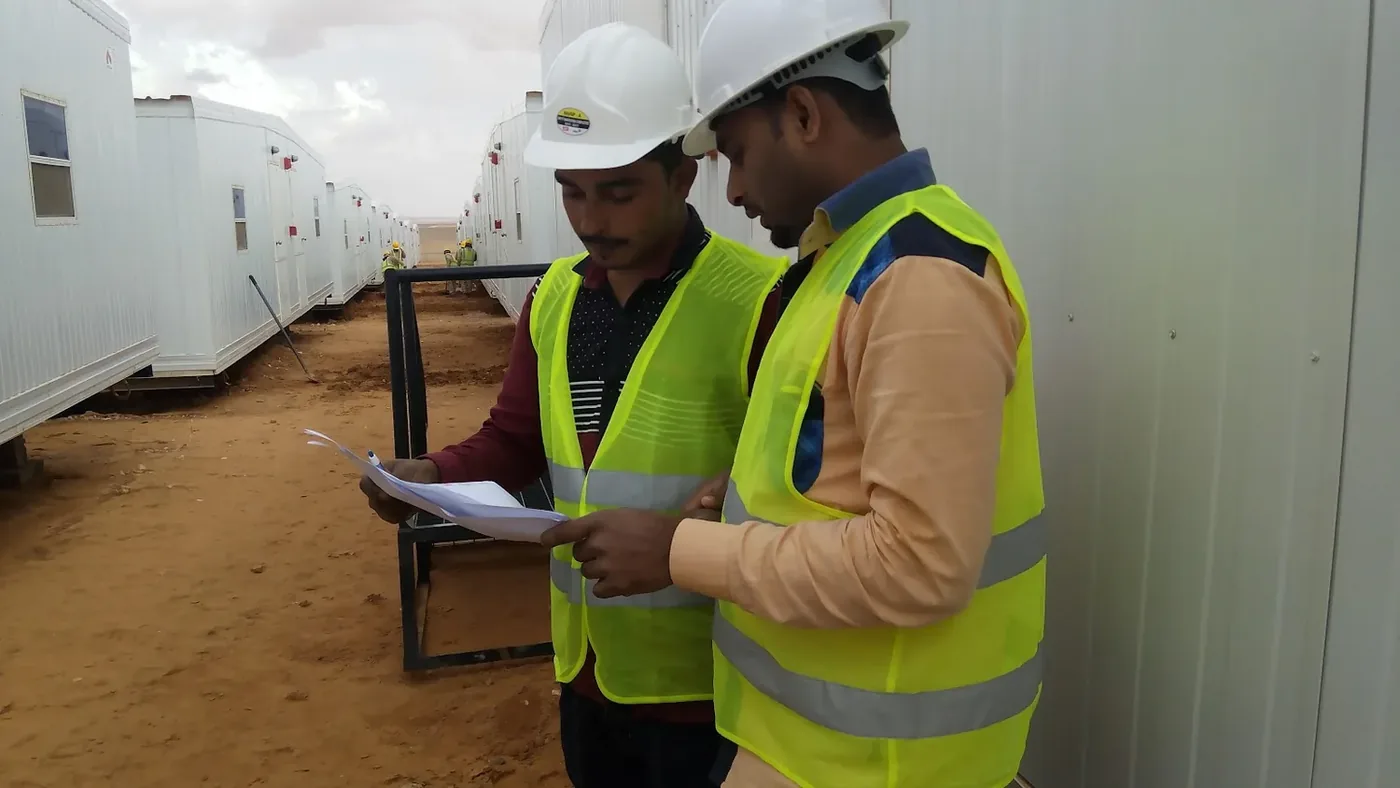 Jubail workforce-accommodation reference depicting site inspection and work planning for the Turaif labour camp project