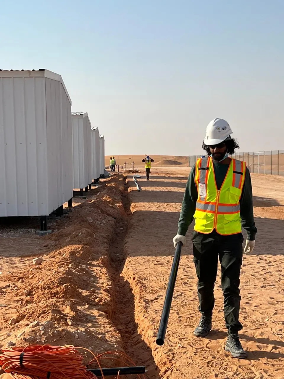 Jubail workforce-accommodation reference depicting structured cabling and conduit installation across the Aramco JGC labour camp facilities near Al Kharj